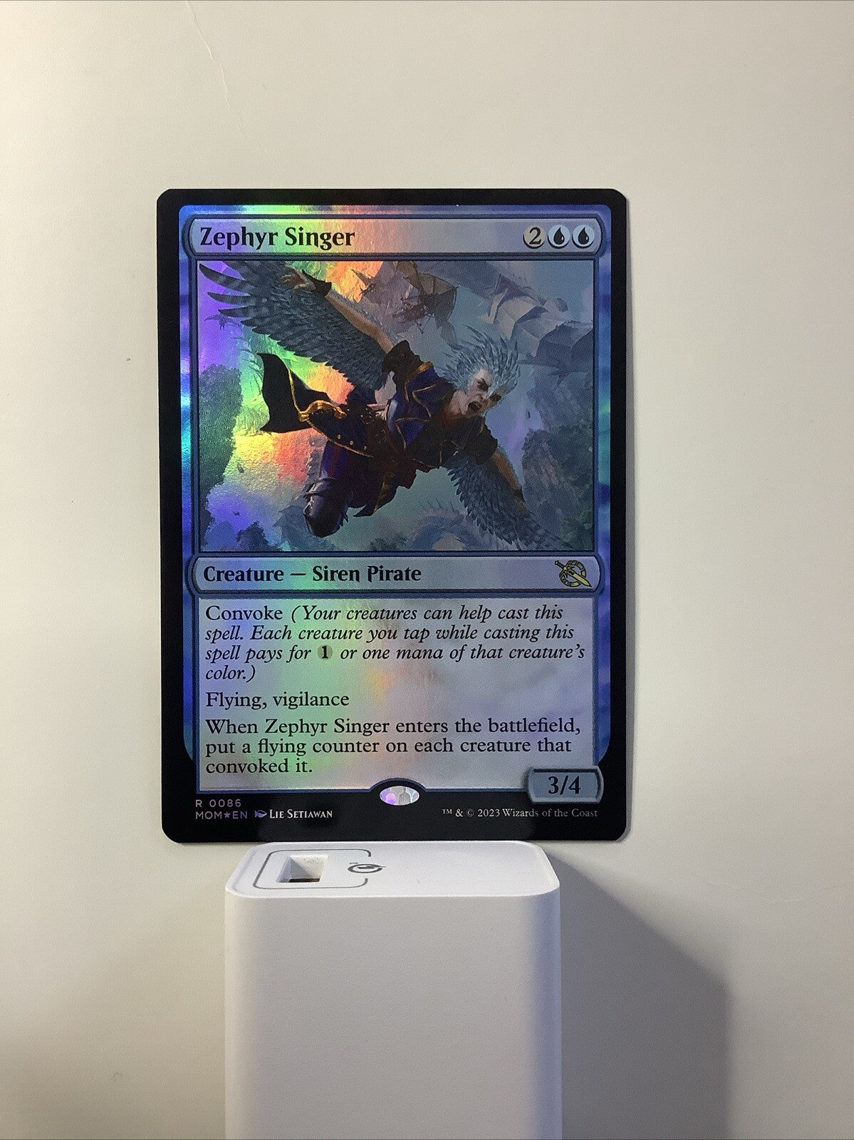 Zephyr Singer Foil from March of the Machine, card #086.