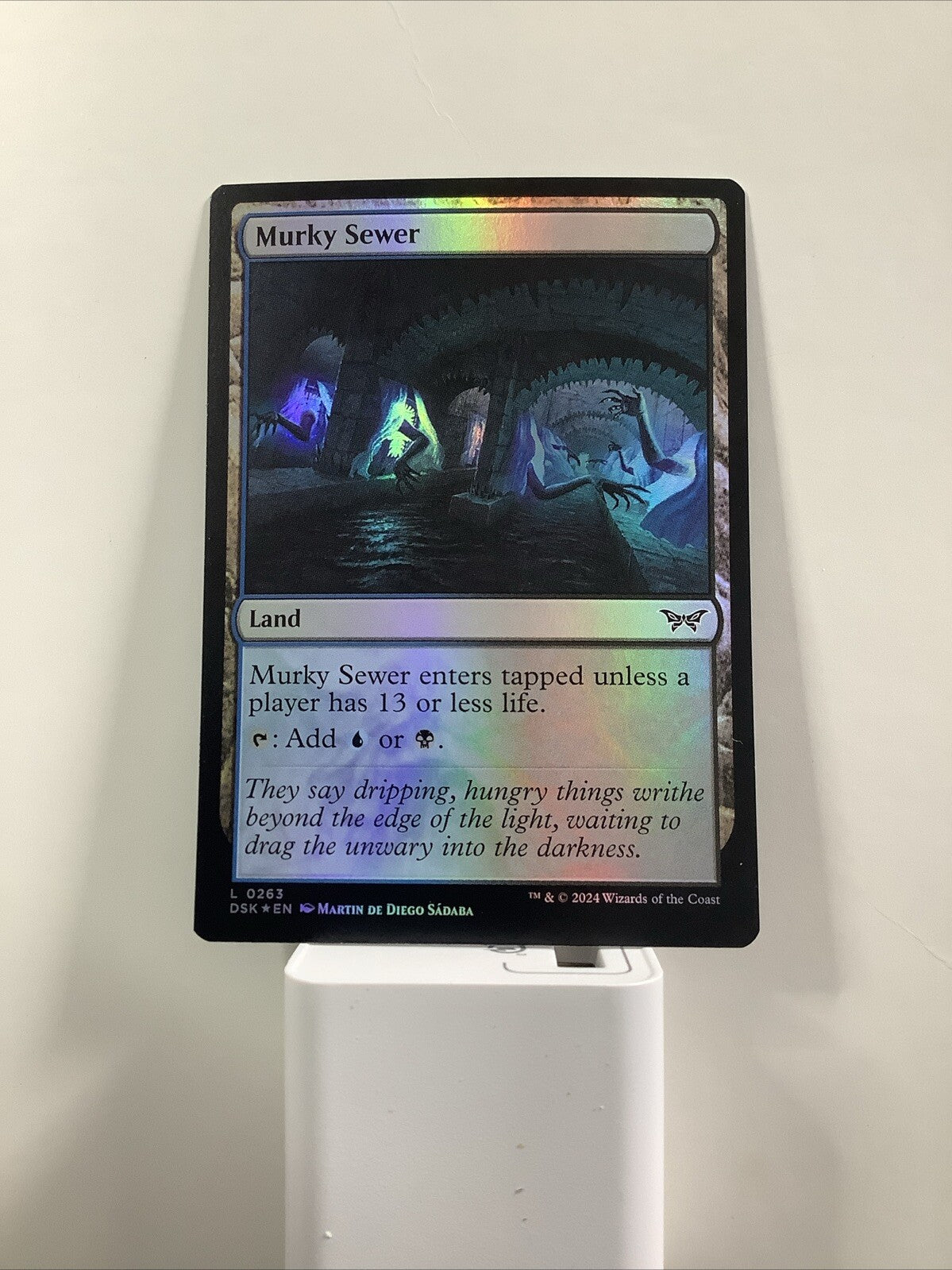 Murky Sewer #263 foil finish from Duskmourn: House of Horror.