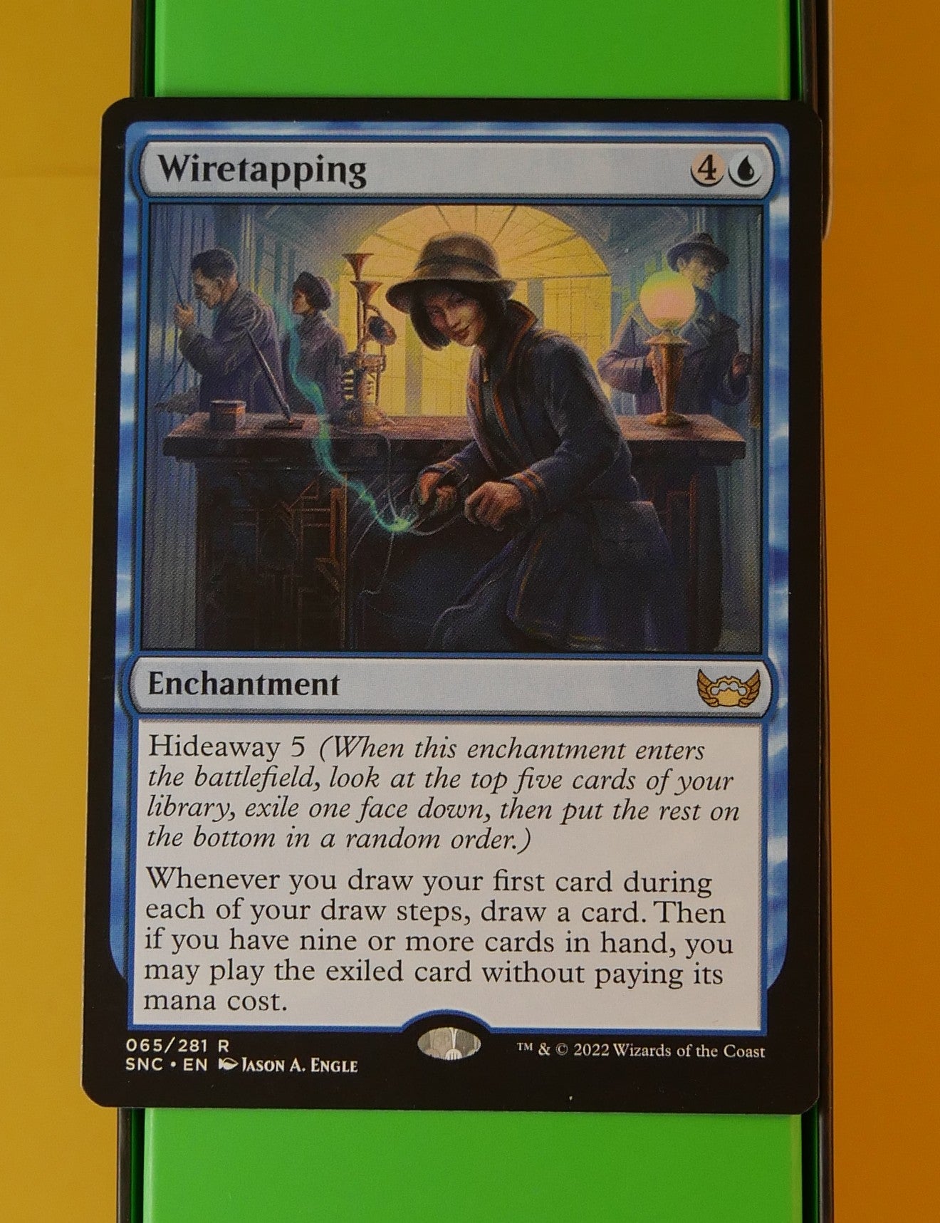 Wiretapping rare blue enchantment from Streets of New Capenna