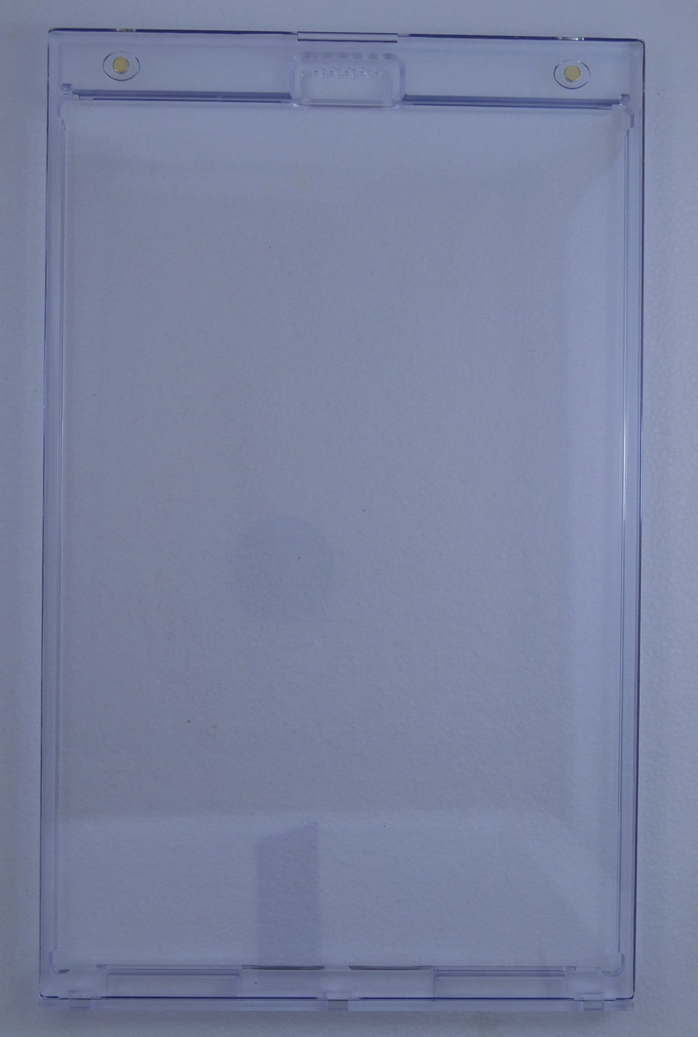 Empty BCW magnetic comic book holder showing clear rigid plastic construction