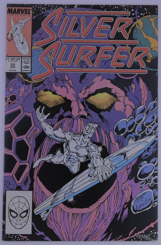 Silver Surfer #22 Marvel cover showing Silver Surfer flying in space with a giant purple cosmic face behind him and the title Silver Surfer across the top.
