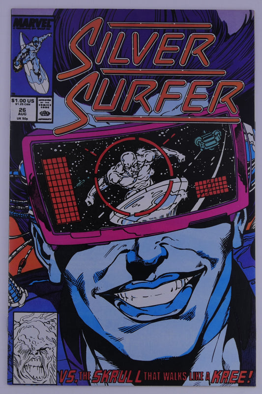 Silver Surfer #26 Marvel cover showing a large face wearing visor goggles with Silver Surfer seen in a target reticle, text reading vs the Skrull that walks like a Kree.
