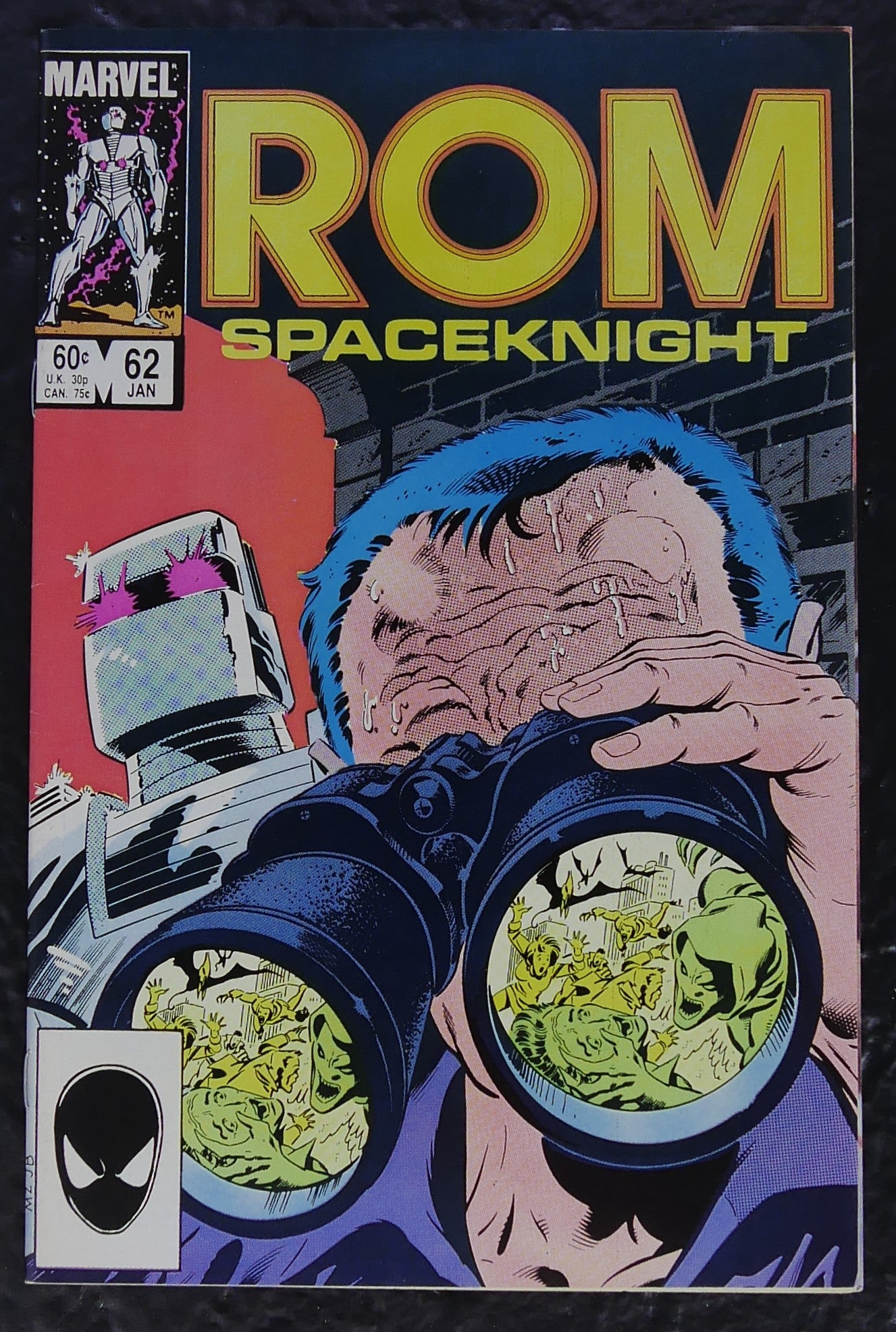 ROM #62 (1985) Marvel comic book cover featuring Forge observing an attack through binoculars