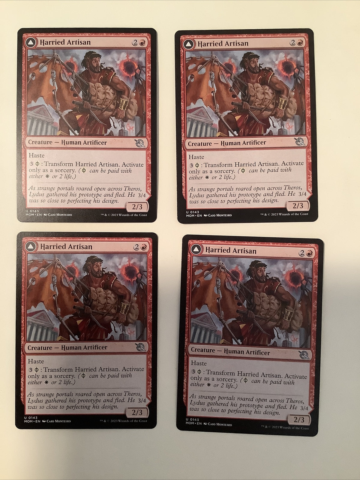 March of the Machine Harried Artisan #143 DFC playset featuring haste, flying pressure, and Phyrexian transformation synergies.