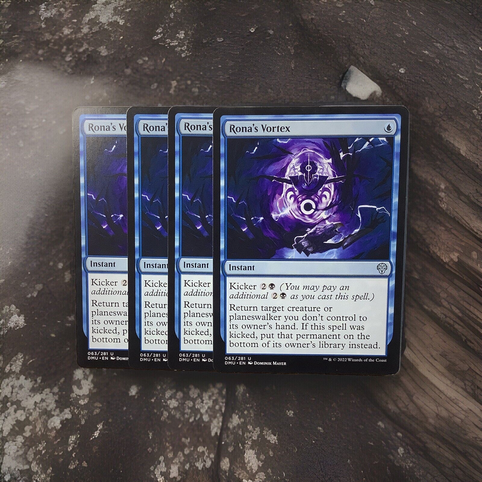 Rona’s Vortex uncommon instant card lot of four from Dominaria United Magic the Gathering set displayed on a stone surface