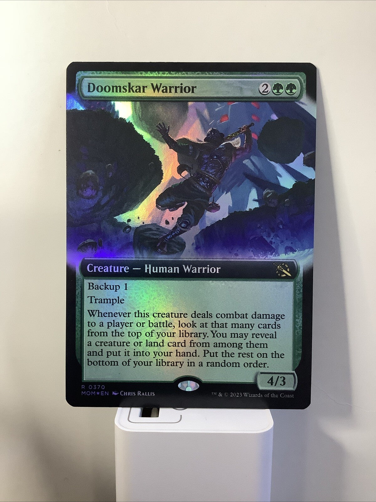 March of the Machine Doomskar Warrior #370 in extended art foil finish.