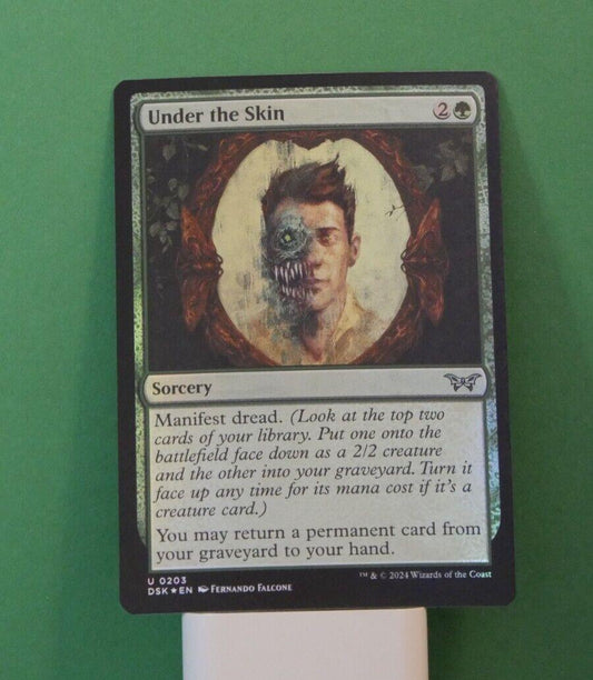 Foil Under the Skin MTG card (Duskmourn DSK 203) black sorcery close-up
