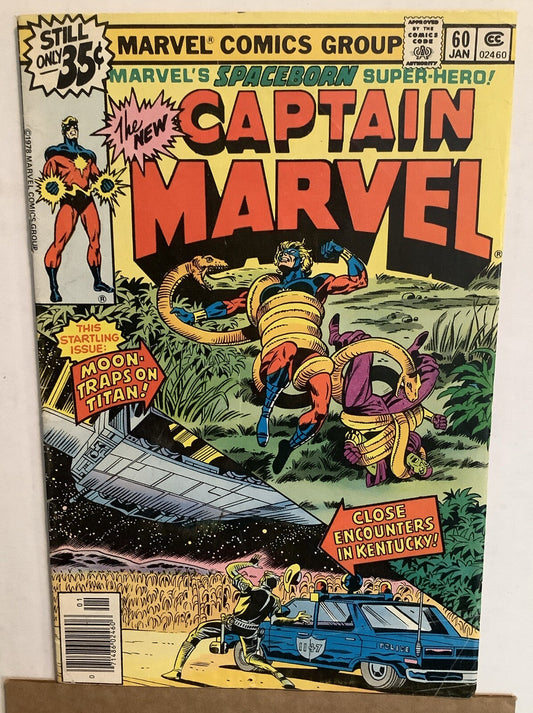 Cover of Captain Marvel #60 Marvel Comics 1979 featuring Captain Marvel battling giant serpents during a cosmic Titan storyline.