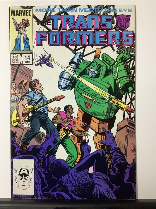 Transformers #14 (1986) Direct Edition comic featuring the Autobots battling a sound-based alien threat
