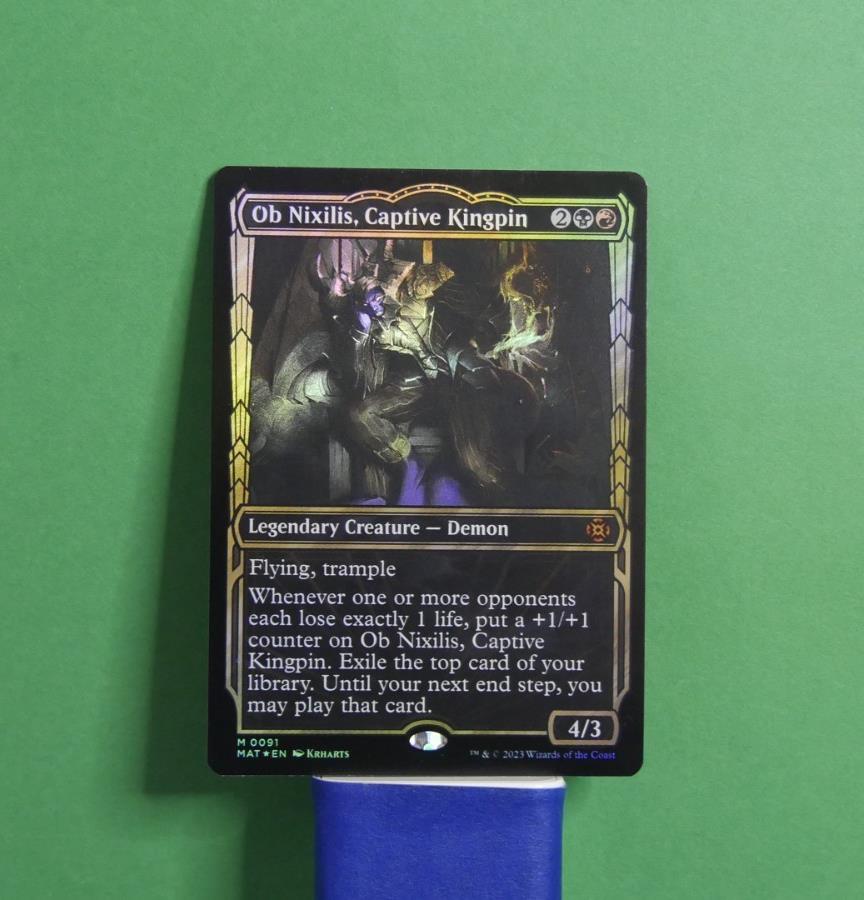 Ob Nixilis, Captive Kingpin Showcase Foil MTG card from March of the Machine: The Aftermath, Legendary Creature Demon 091.
