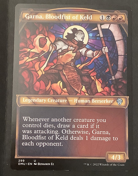 Garna, Bloodfist of Keld DMU 299 showcase regular finish Magic the Gathering card, two copies, Rakdos legendary creature.