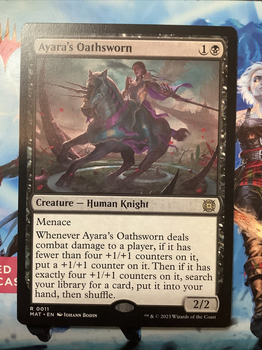 Ayara's Oathsworn MAT 011 regular finish MTG card featuring menace, +1/+1 counter growth, and a powerful tutor reward from March of the Machine The Aftermath.