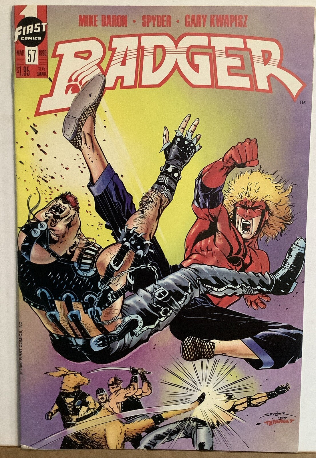 Cover of Badger #57 First Comics 1990 featuring the Badger in a martial arts fight scene against punk-styled enemies.