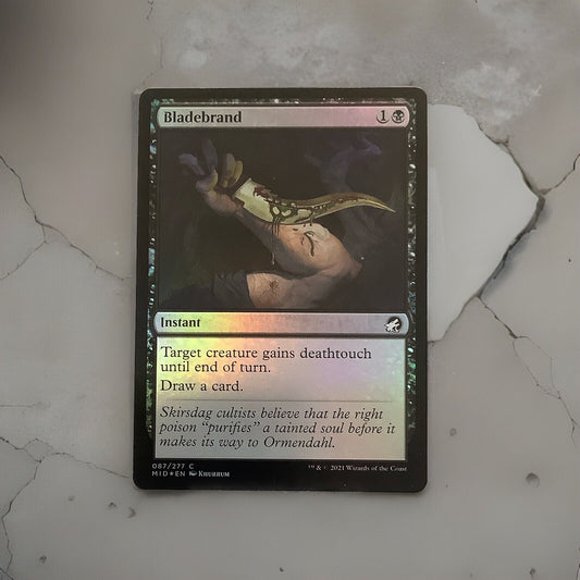 Bladebrand MID 087 foil Magic the Gathering instant card that grants deathtouch and draws a card.
