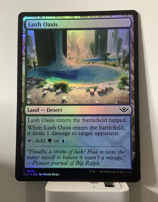 Lush Oasis OTJ 0261 foil Magic the Gathering green blue Desert land card.