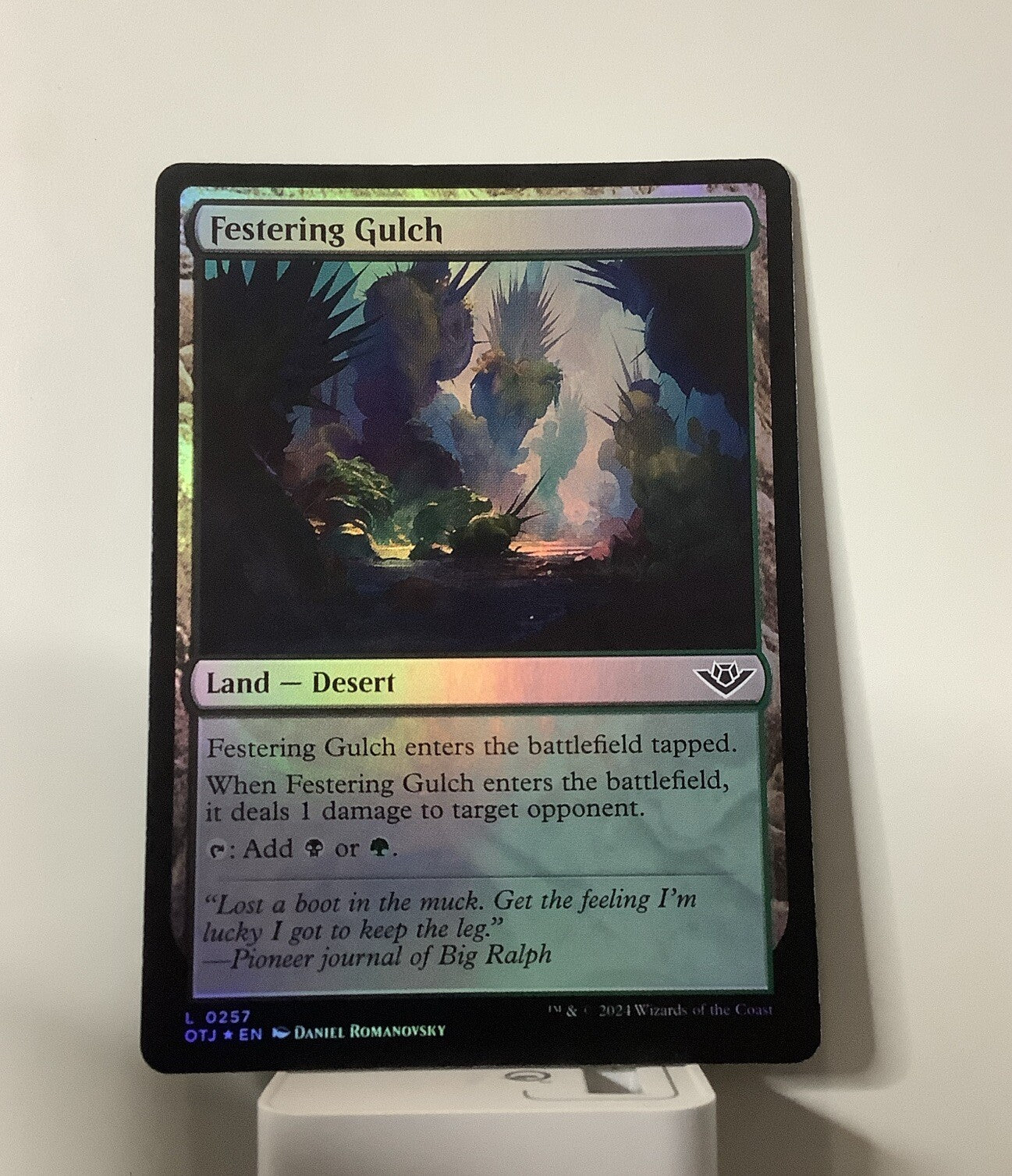 Festering Gulch foil MTG OTJ 257 black green desert land