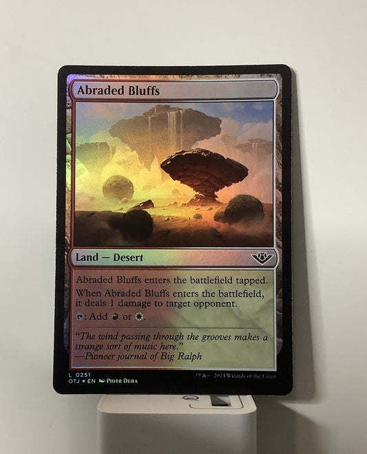 Abraded Bluffs OTJ 251 foil MTG card front
