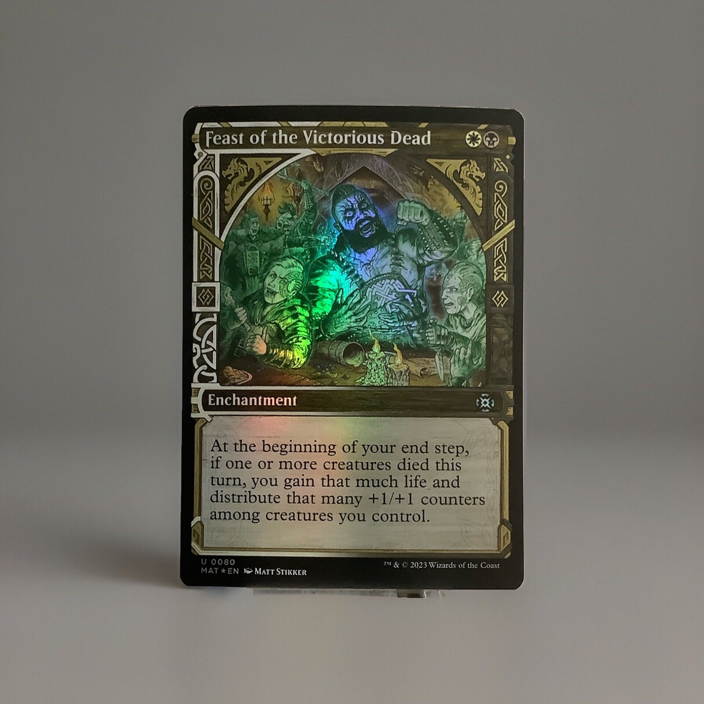 Feast of the Victorious Dead showcase foil enchantment card from March of the Machine The Aftermath 0080