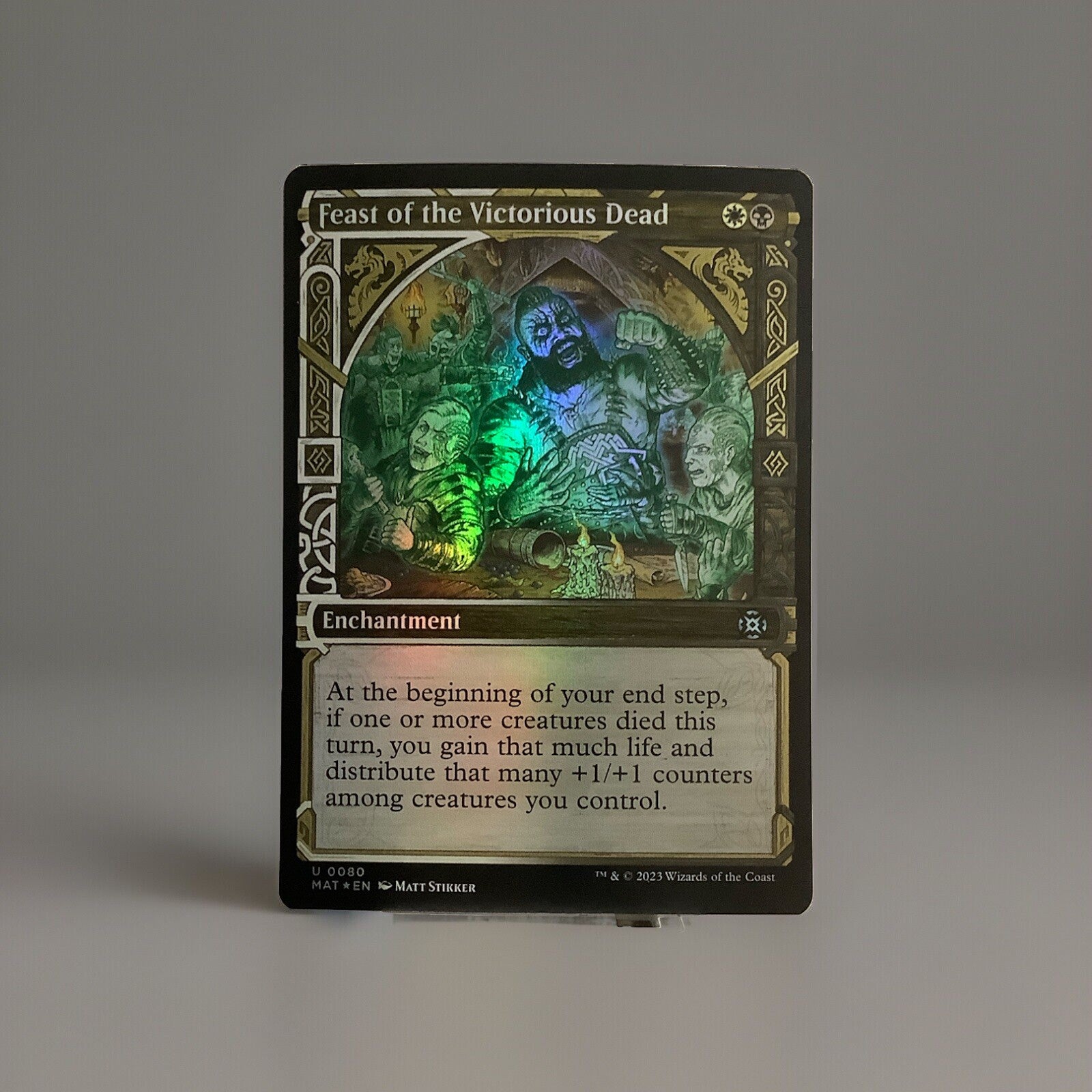 Feast of the Victorious Dead showcase foil enchantment card from March of the Machine The Aftermath 0080