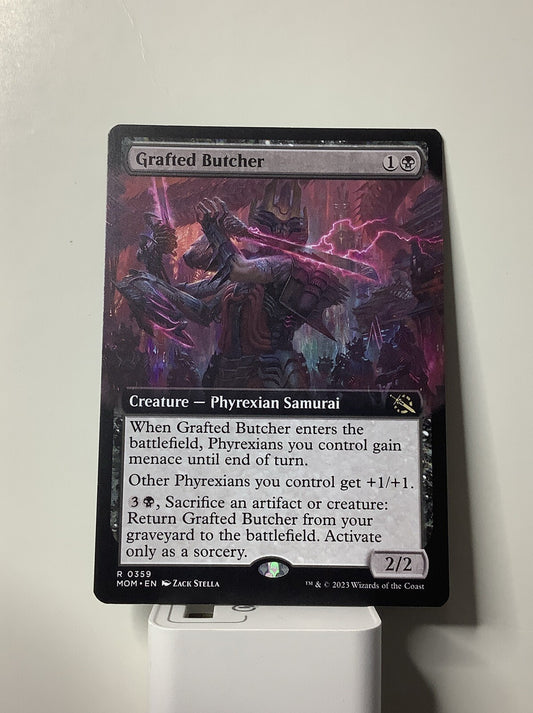 Grafted Butcher Extended Art MTG card from March of the Machine featuring Phyrexian tribal support, menace synergy, and graveyard recursion.