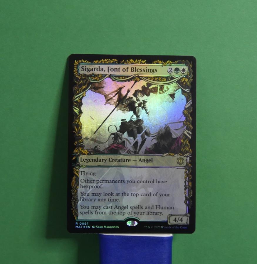 Sigarda, Font of Blessings Showcase Foil MTG card from March of the Machine: The Aftermath, Legendary Creature Angel 085.
